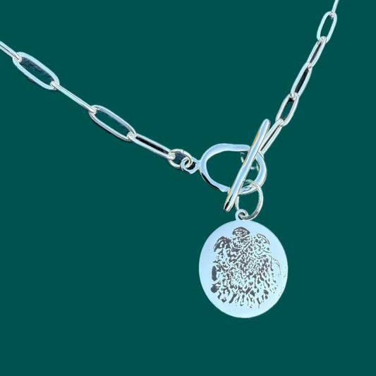 Double sided silver pendant